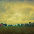 Red Barn Under Stormy Skies